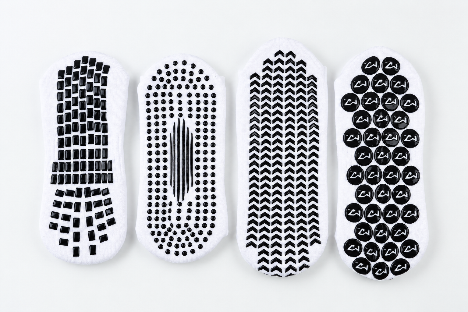 Four different silicone grip pattern layouts on sock soles