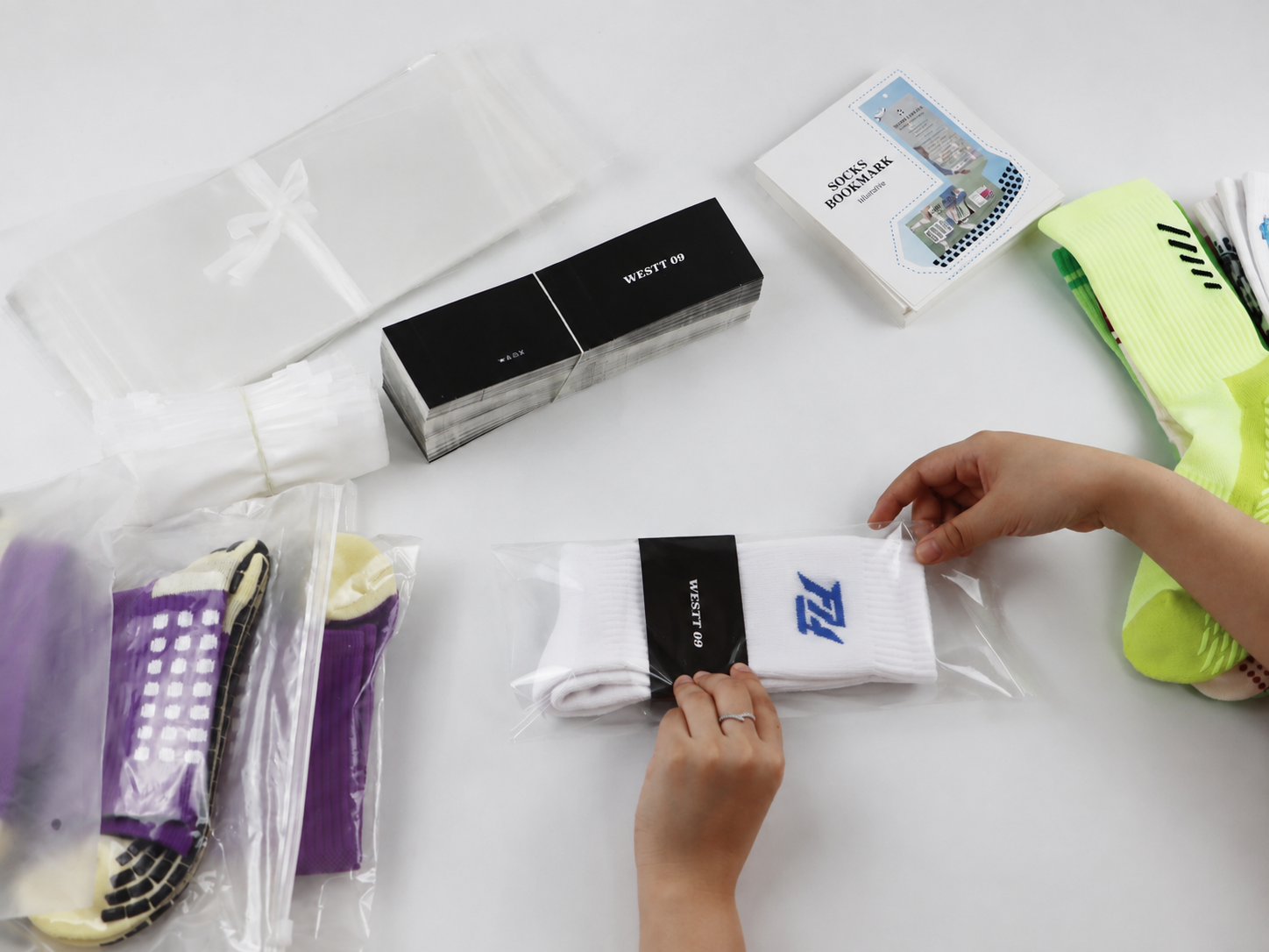 Different packaging formats for socks including bands, bags and retail boxes