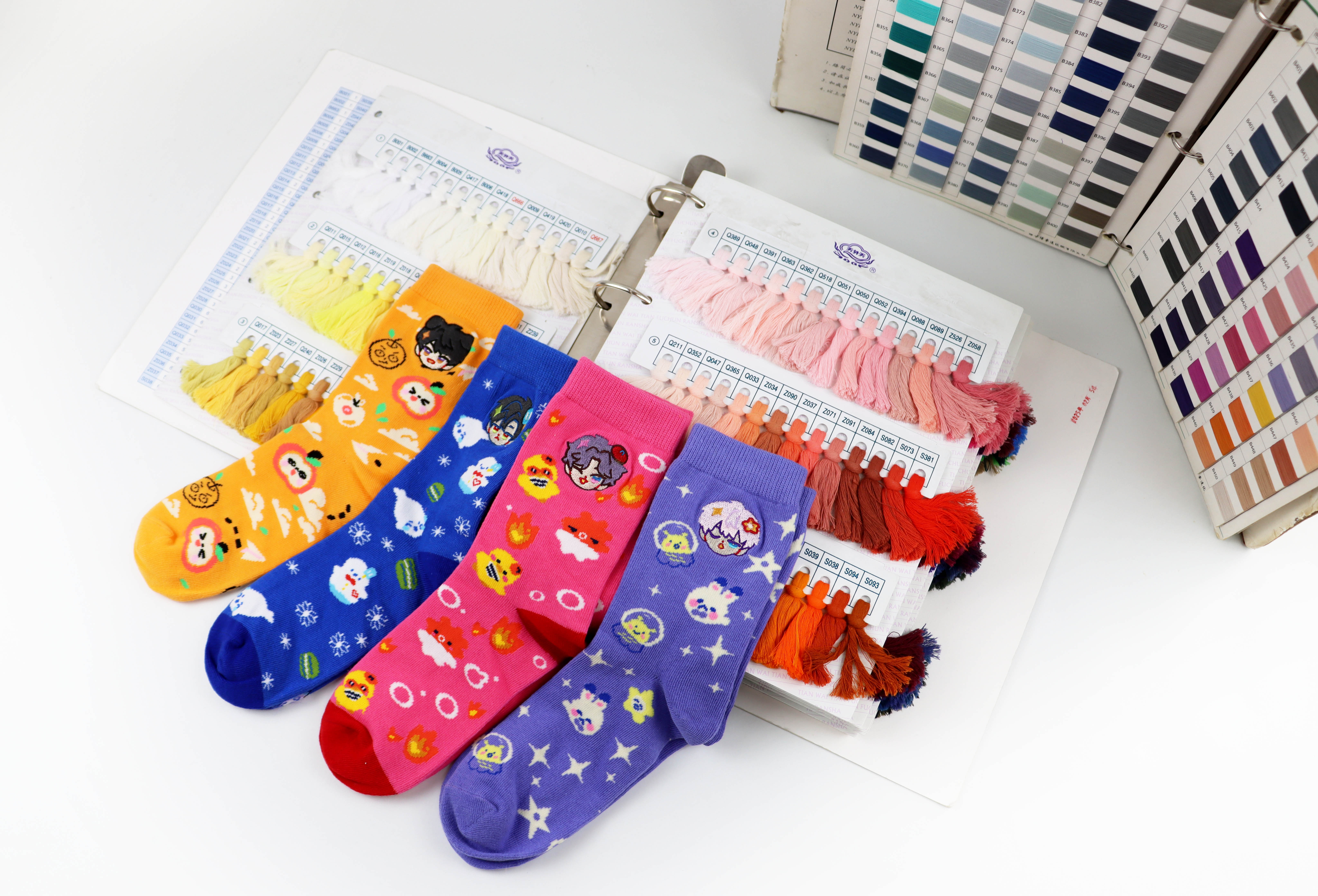 Sock styles and yarn color cards used when planning a private label order
