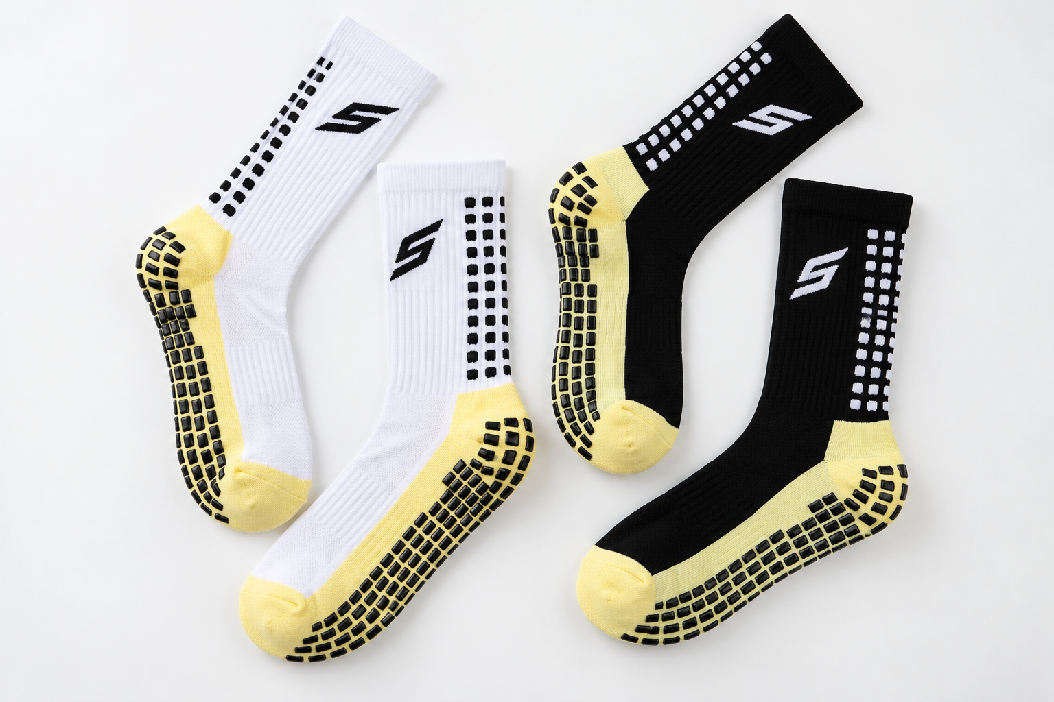 First sample football grip socks in white and black colorways