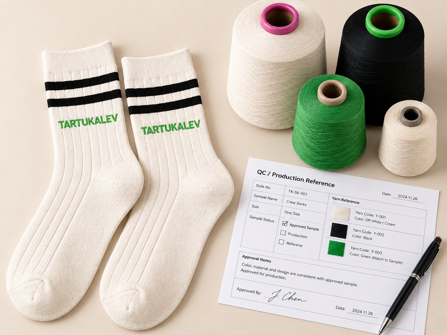 Cream crew socks, yarn cones and a production reference sheet