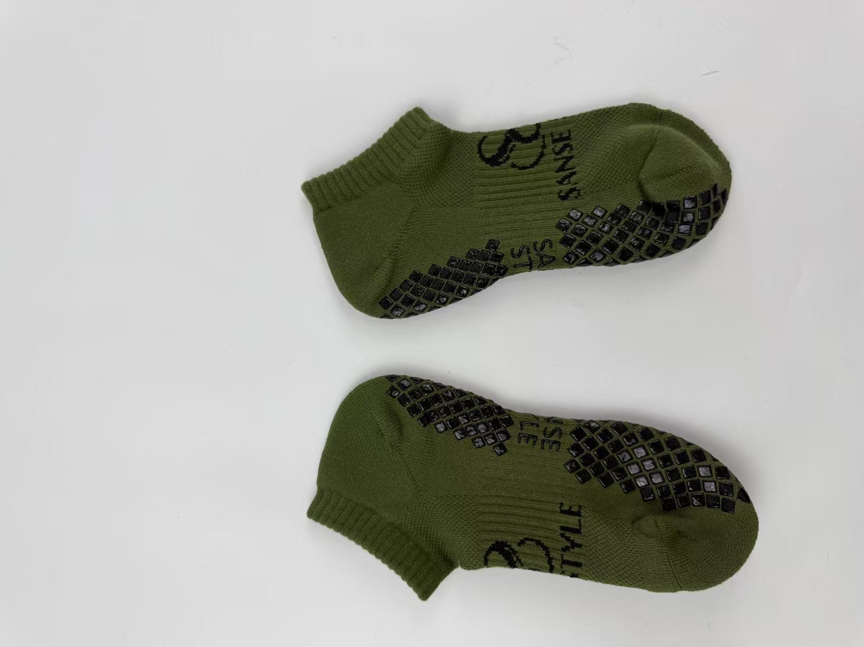 Olive branded Pilates grip sock sample