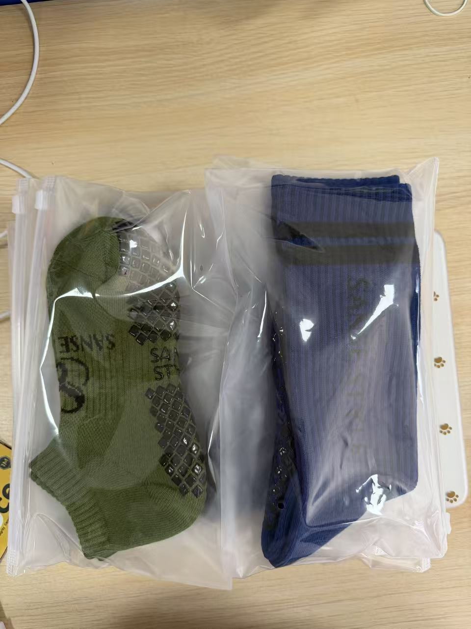 Sample grip socks inside clear individual bags