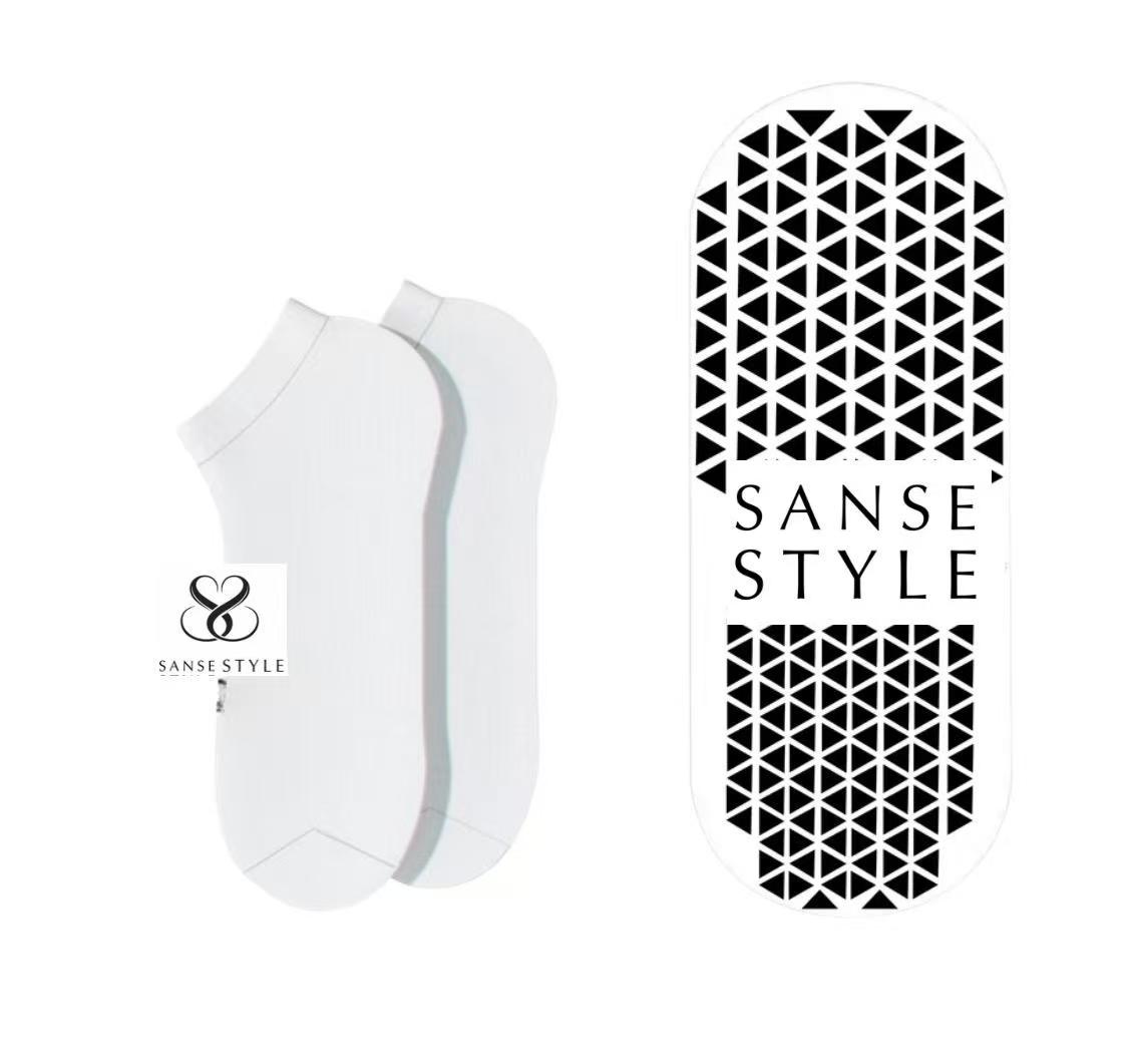 Initial low-cut sock concept with branding and geometric grip artwork