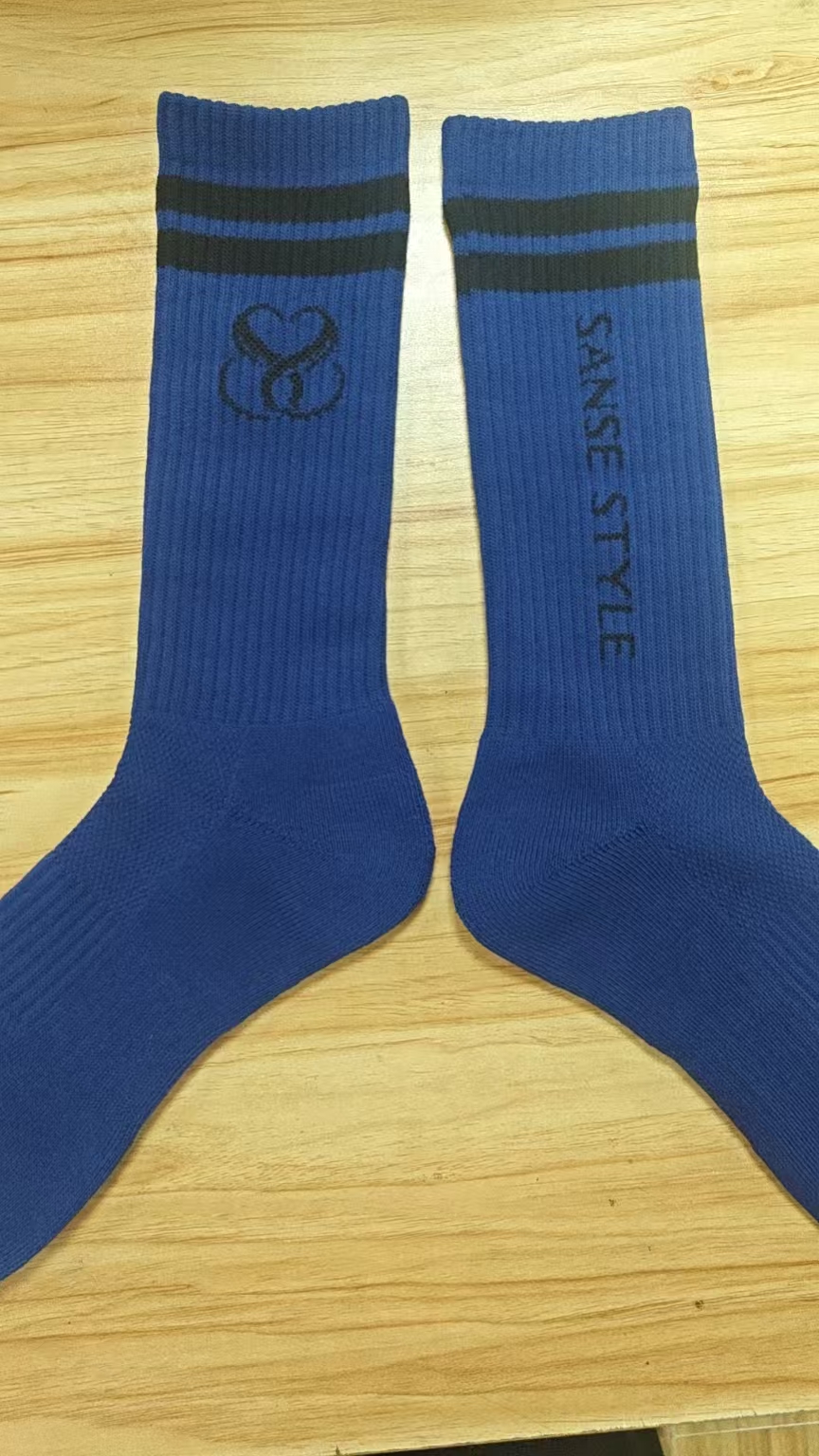 Blue crew sock sample showing logo placement on the leg