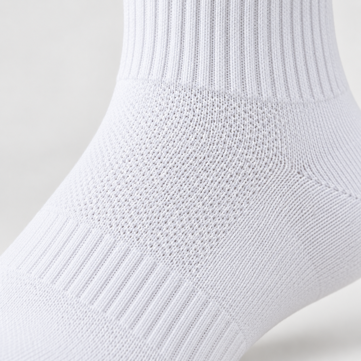 Close-up of custom knit construction and jacquard logo detail