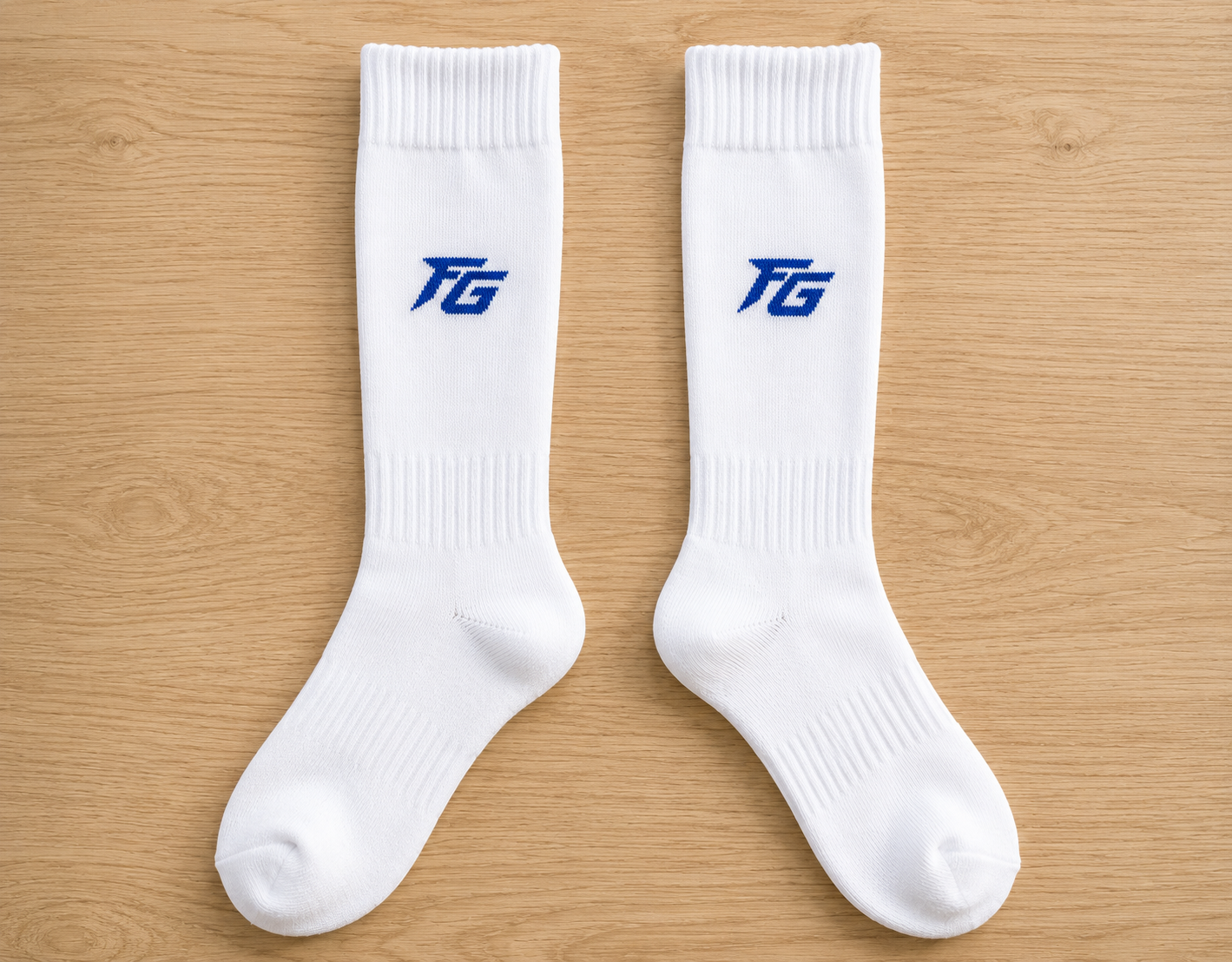 Custom sock prototype reviewed against the approved brand direction