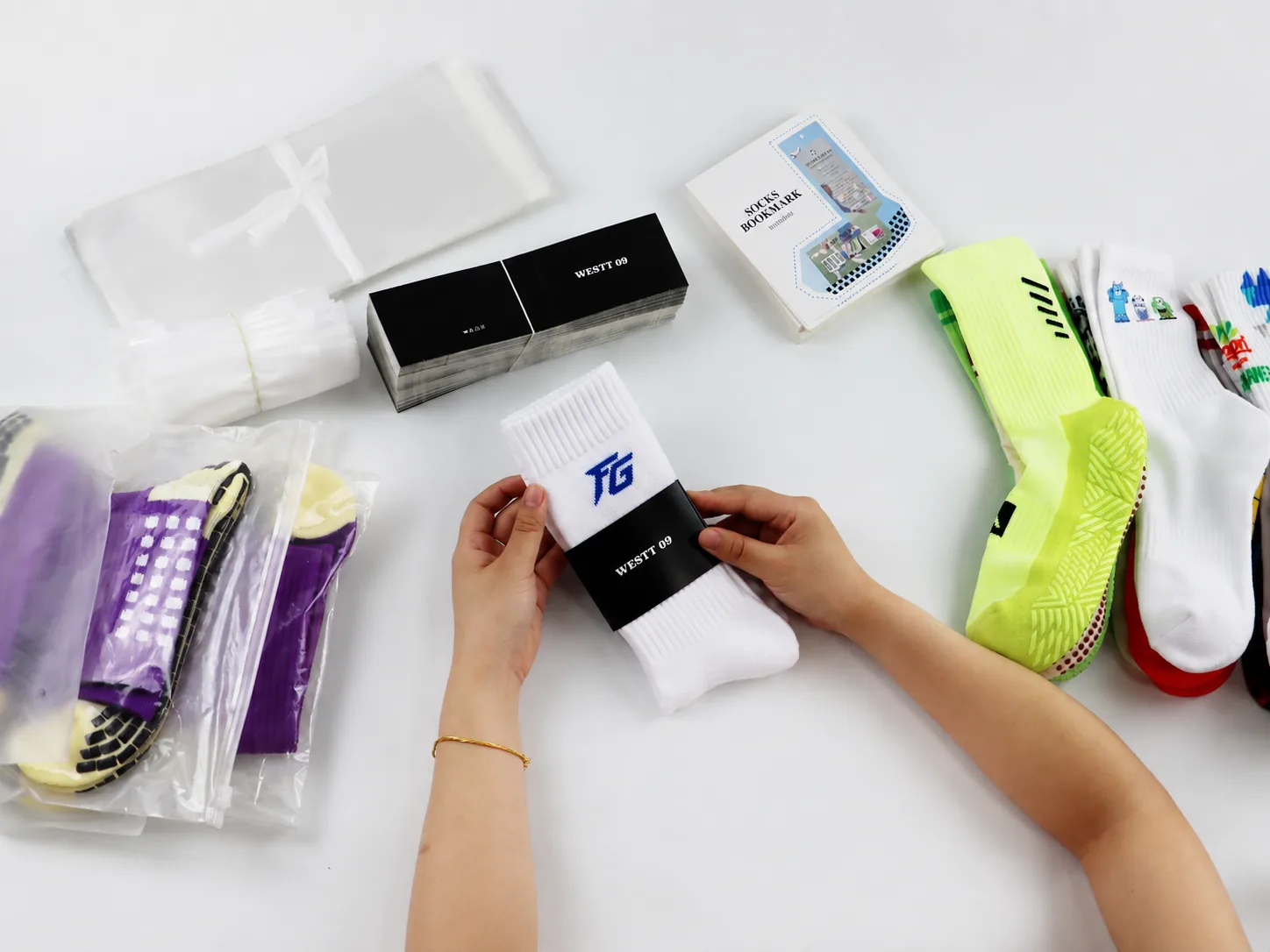 Sock paper band placement being checked with packaging materials
