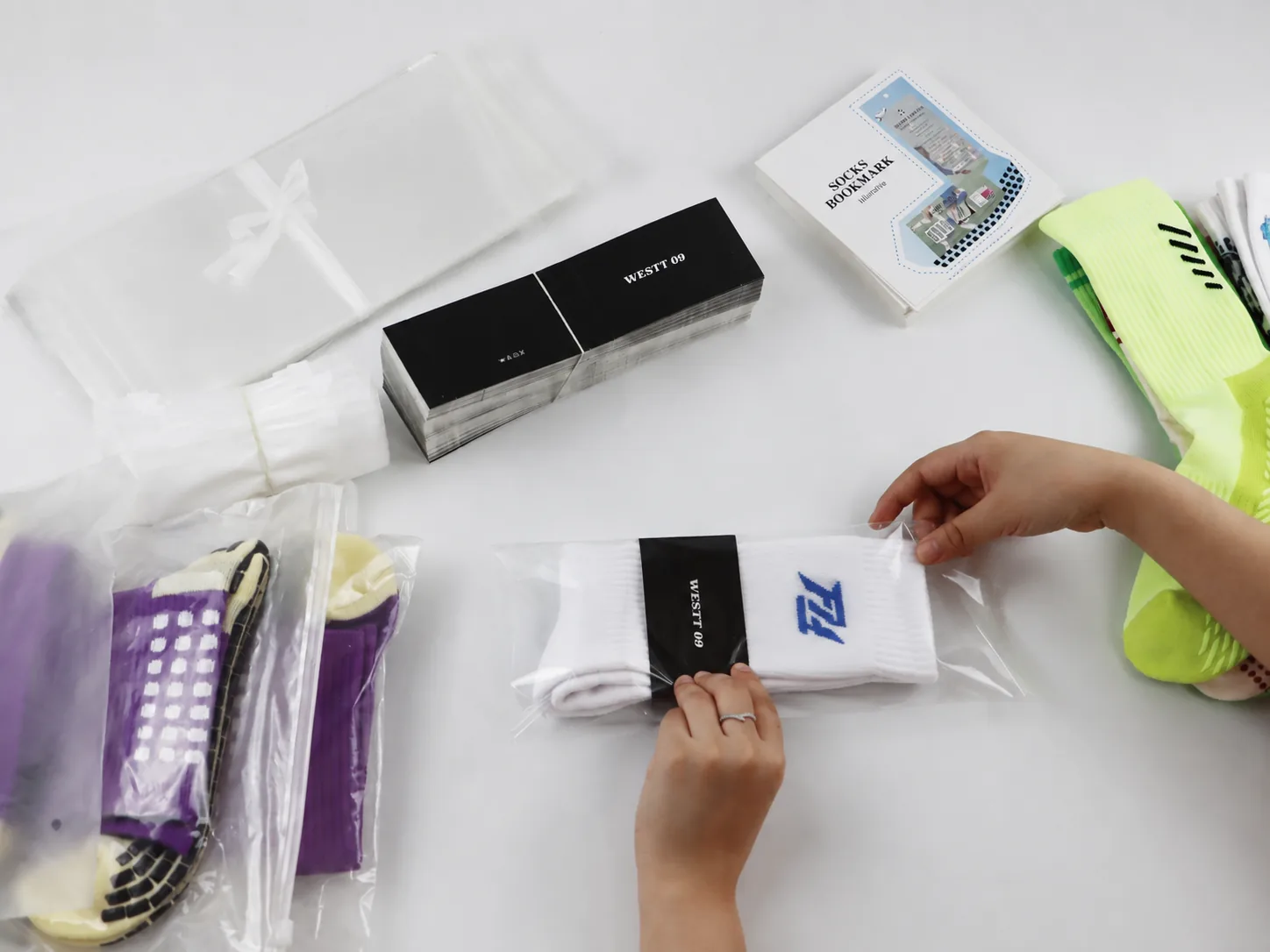 Branded sock in clear retail pack being reviewed