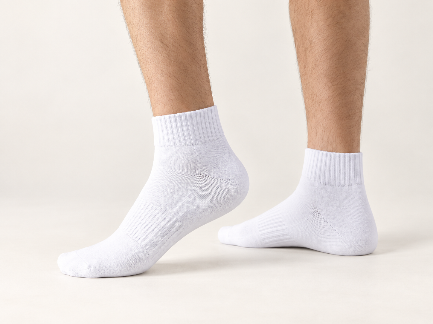White Essential Quarter 01 socks shown on foot at quarter height