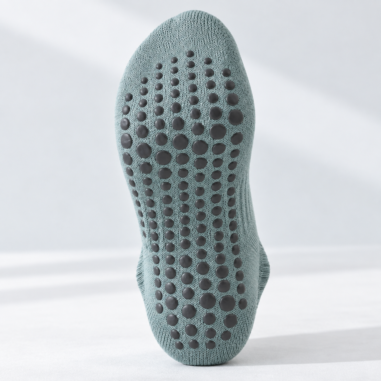 Close-up of grip sock sole coverage and texture